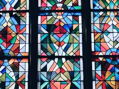 photo of multicolored glass mosaic windowpane